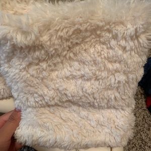 White Kohl’s leg warmer boots.